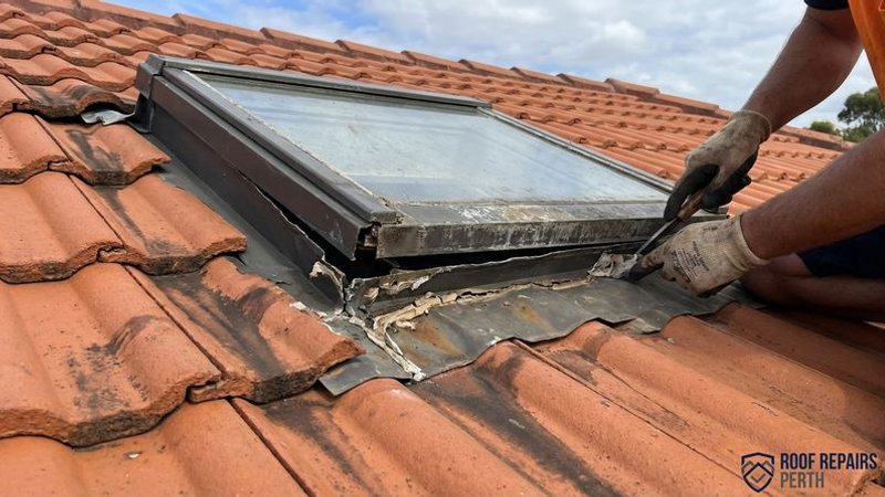 Detailed view of deteriorated flashing around a skylight on a Perth roof with visible gaps and dried-out sealant
